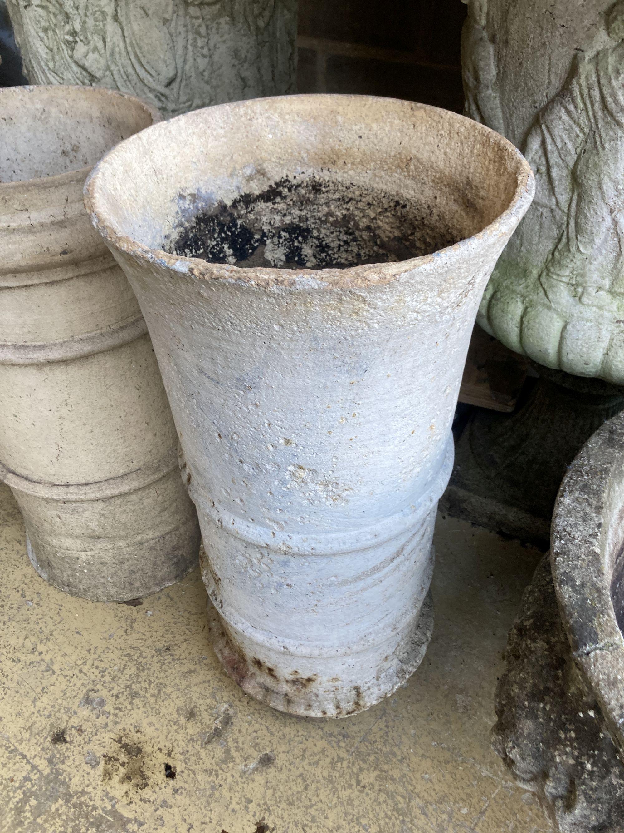 Two glazed earthenware chimney pots, larger 62cm high